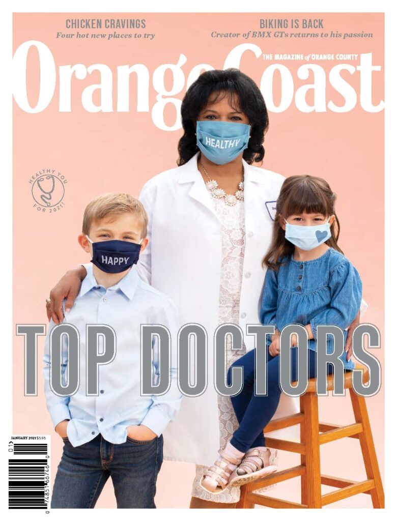 Orange Coast Top Doctors Magazine cover, dentist with two young patients, all wearing masks