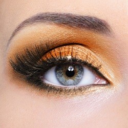 Woman eye with orange make-up